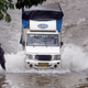 Vehicles struggled to make it through the deluge of water on the streets.